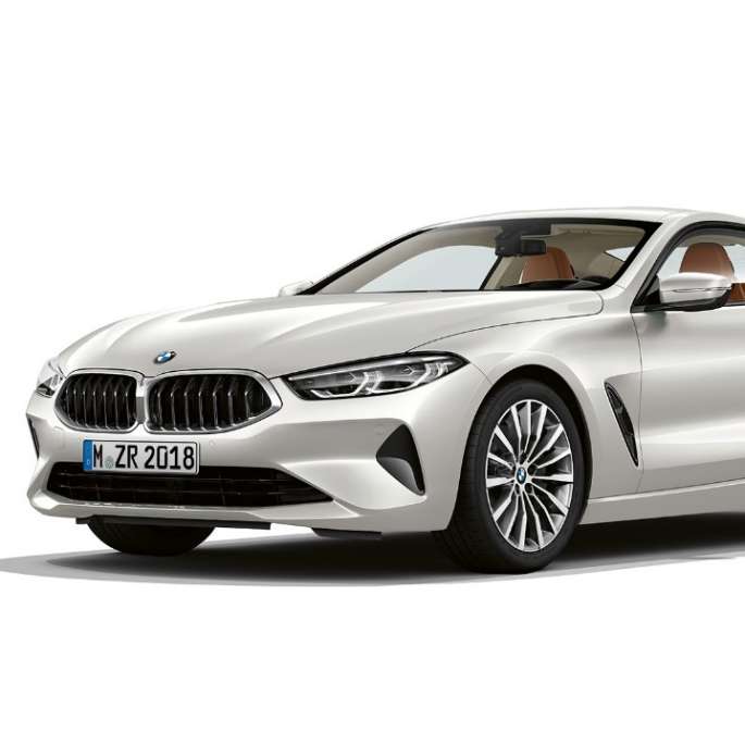 BMW 8 Series Coupé, three-quarter front view. BMW 8 Series Coupé, Mineral White metallic, three-quarter front view.