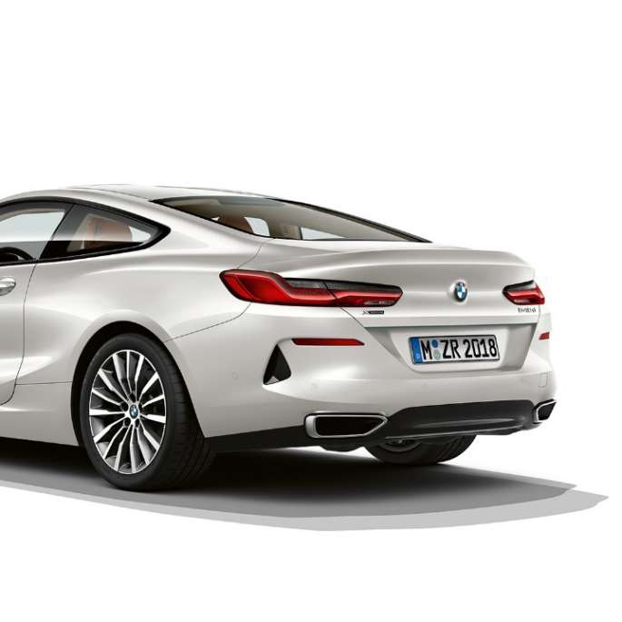 BMW 8 Series Coupé, three-quarter back view. BMW 8 Series Coupé, Mineral White metallic, three-quarter back view.