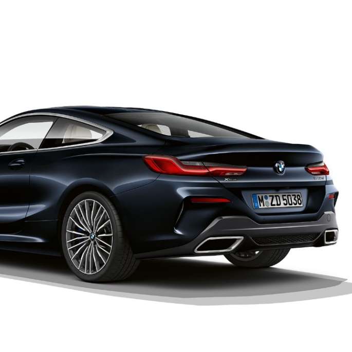BMW 8 Series Coupé, three-quarter back view. BMW 8 Series Coupé, Carbon Black metallic, three-quarter back view.