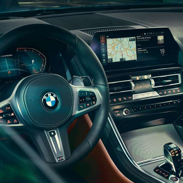 BMW 8 Series Coupé, cockpit. G15 BMW 8 Series Coupé, cockpit, close-up view with steering wheel and control display. G15