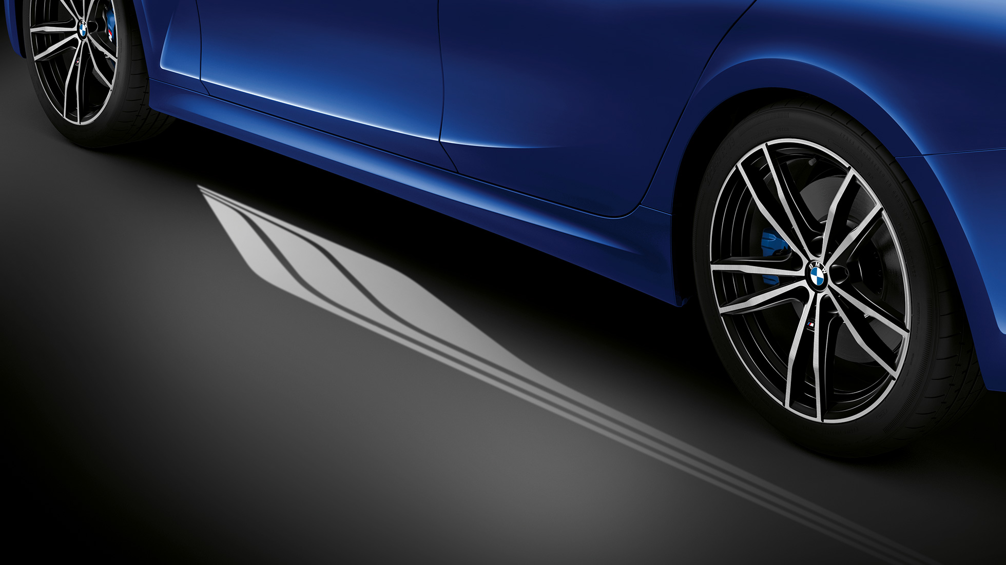 BMW 3 Series Sedan, Welcome Light Carpet. G20 Detailed side view of the open driver's door with Welcome Light Carpet. G20