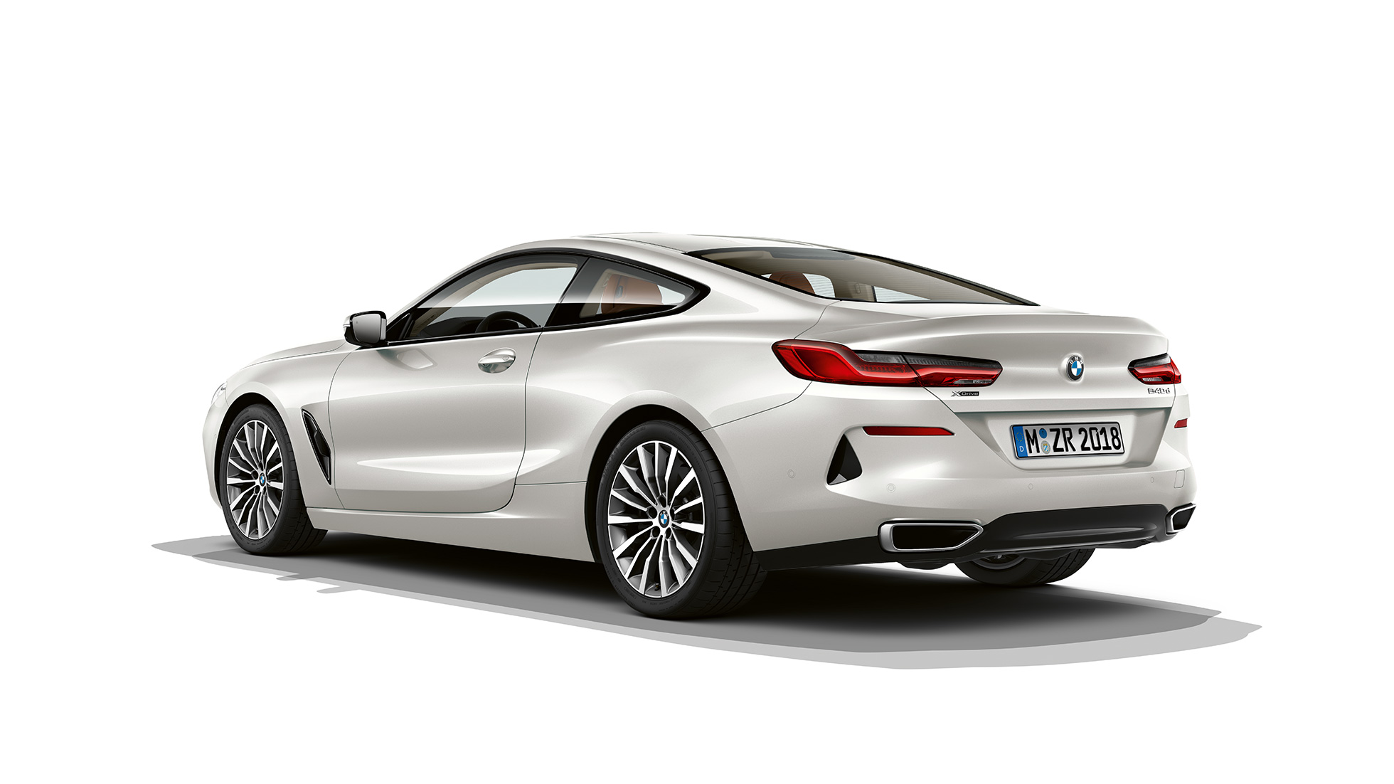 BMW 8 Series Coupé, three-quarter back view. G15 BMW 8 Series Coupé, Mineral White metallic, three-quarter back view. G15