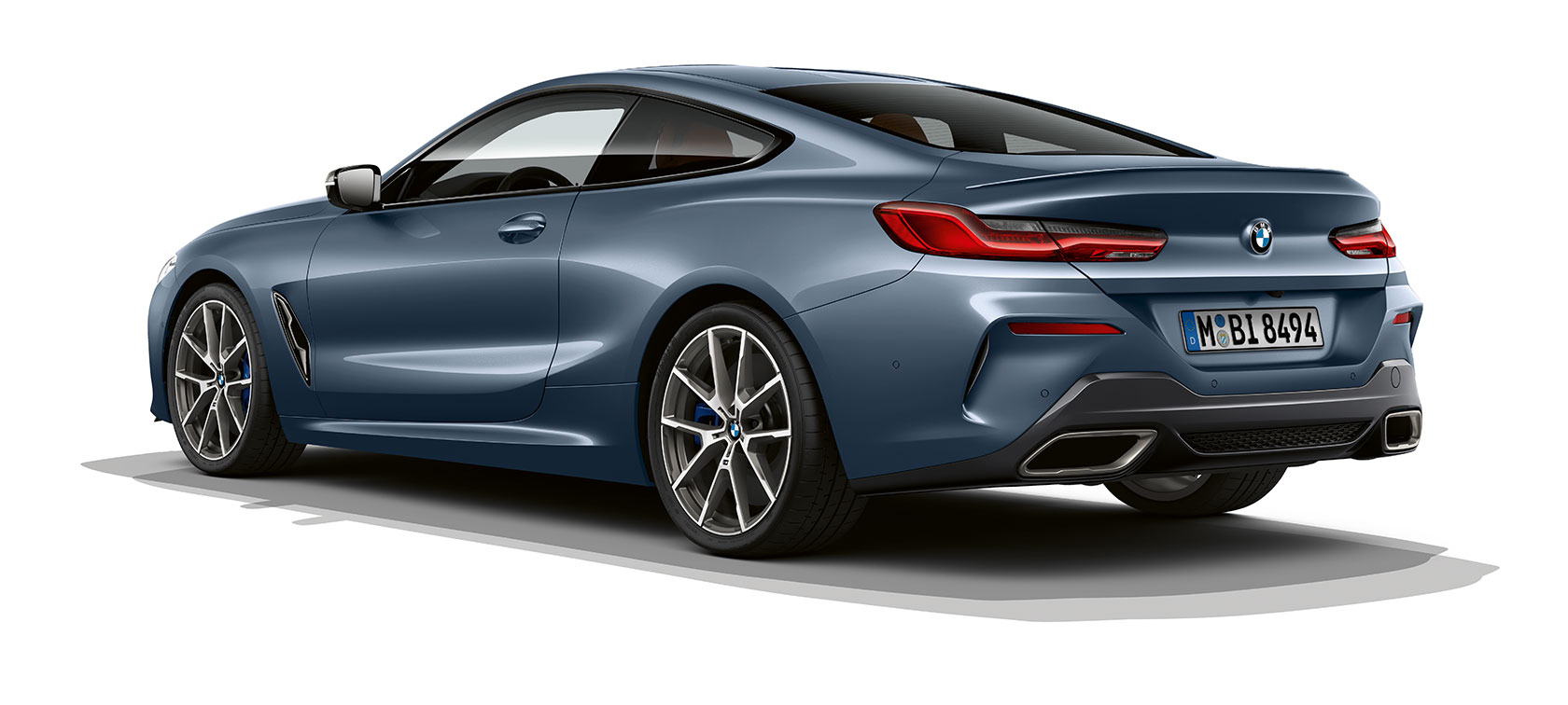 BMW 8er Coupé, Barcelona Blue metallic. G15 BMW 8er Coupé, Barcelona Blue metallic, three-quarter rear view. G15