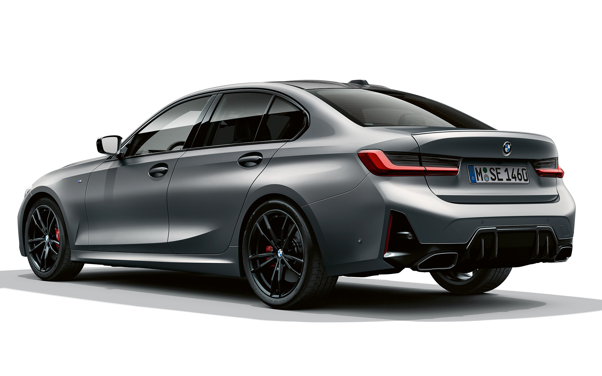 M rear spoiler BMW M340i xDrive Sedan G20 BMW M340i xDrive Sedan G20 BMW Individual Frozen Pure Grey metallic Three-quarter rear view M rear spoiler