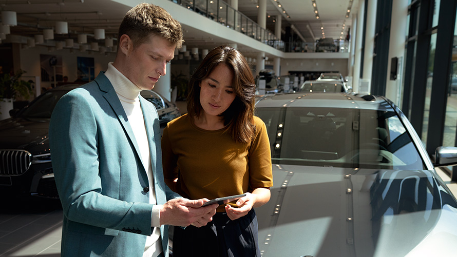 BMW employee advises a customer BMW employee advises a customer