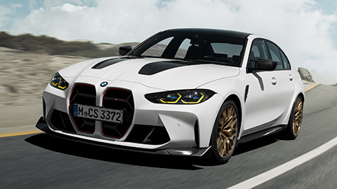 BMW M3 CS G80 three-quarter front view driving on the street BMW M Series BMW M3 CS G80 three-quarter front view driving on the street