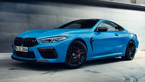 BMW M8 Gran Coupé (F93) three-quarter side view standing with model