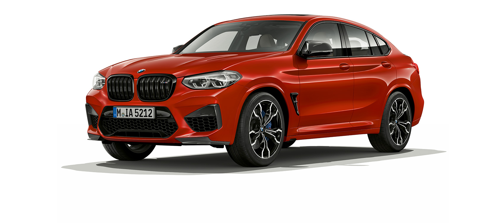 BMW X4 M Competition, three-quarter side view. F98 BMW X4 M Competition in Toronto Red metallic, exterior, three-quarter side view. F98