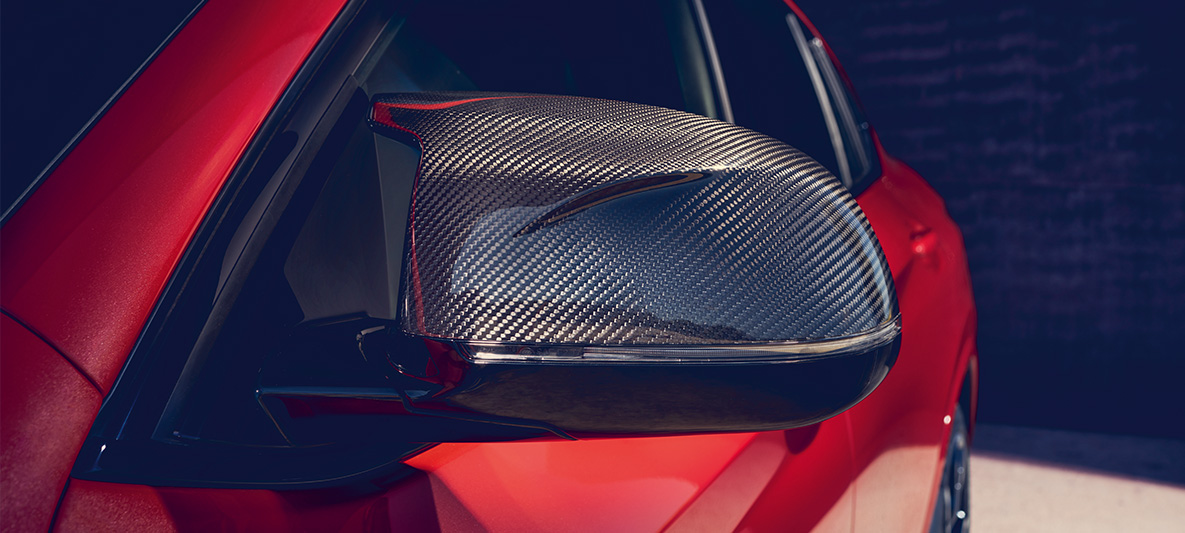 BMW X4 M Competition, mirror caps in carbon. F98 BMW X4 M Competition in Toronto Red metallic, exterior, M Carbon exterior package, mirror caps in carbon. F98