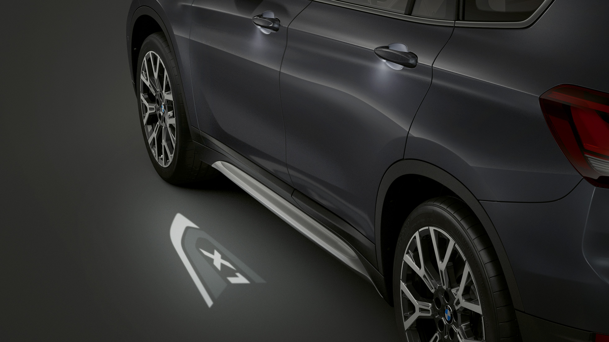 BMW X1, LED-Projection “X1”. F48 BMW X1, side view with focus on LED-Projection “X1”. F48