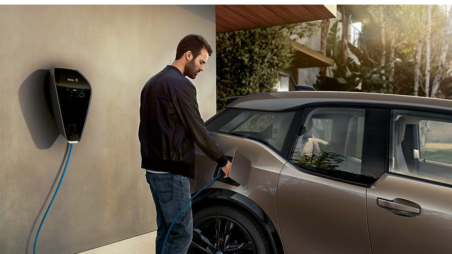 BMW i3s man at charging station BMW charging BMW i3s man at charging station