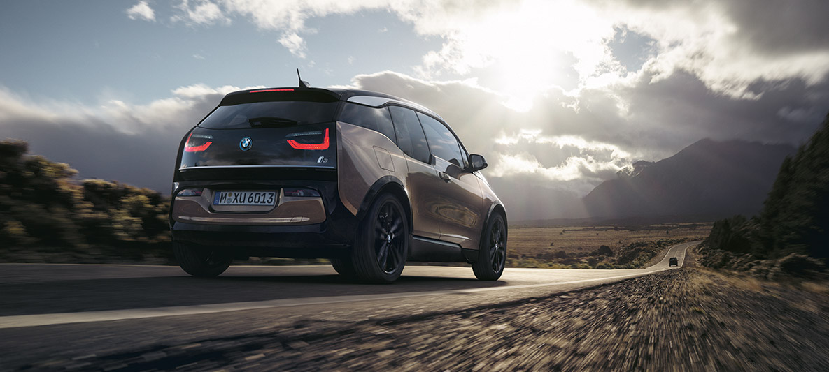 BMW i3s against mountain scenery BMW range example BMW i3s against mountain scenery three-quarter rear view