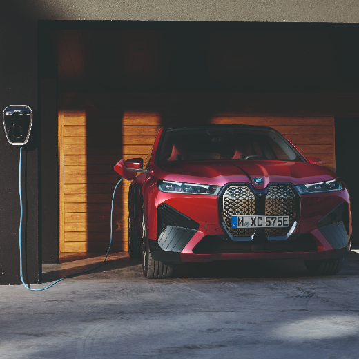 BMW iX1 U11 BEV Charging situation in front of garage 